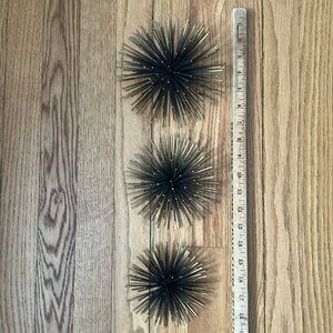 Trio of gold metal wall decor